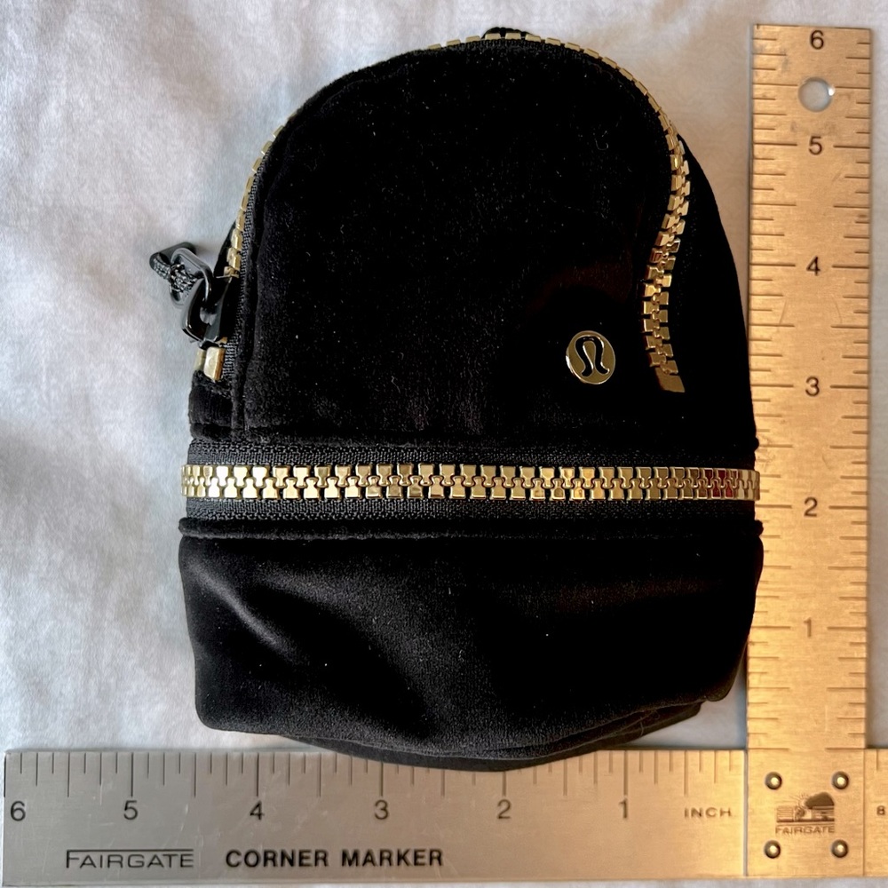 Lululemon City Adventurer Backpack 
Nano, Black velour w/ gold zipper & logo.